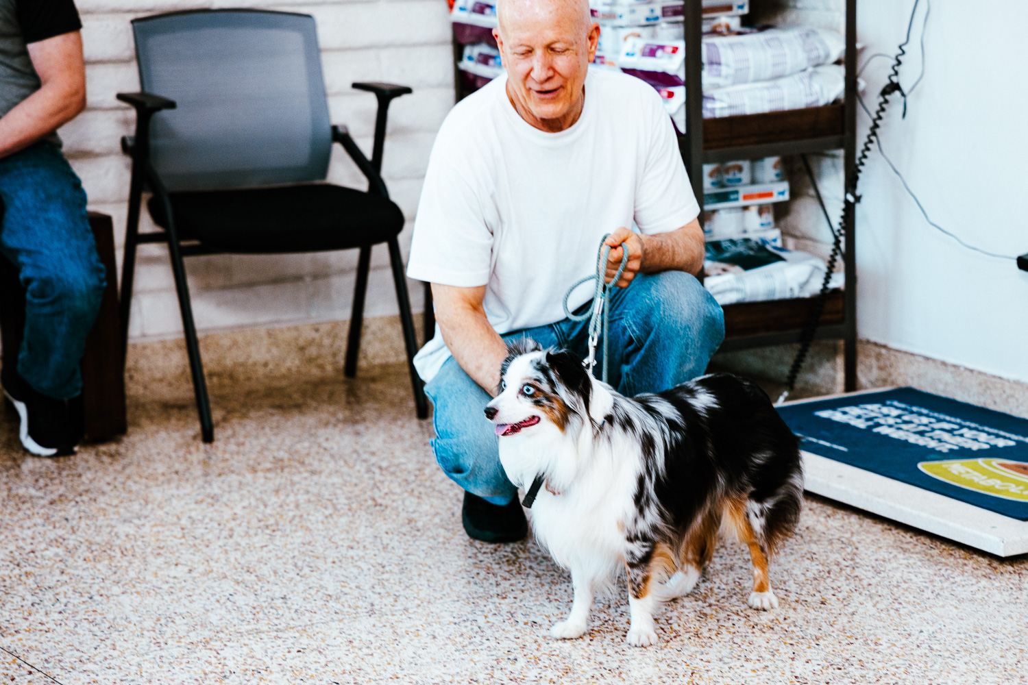 Man with his Australian Shepard - imperial animal hospital